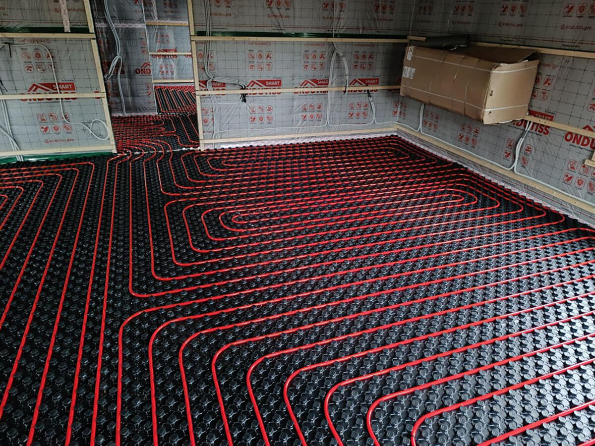 Система тёплого пола на этапе укладки труб перед заливкой стяжки